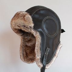 Gender: UnisexDepartment Name: AdultItem Type: Bomber HatsPattern Type: SolidModel Number: pu002Material: PolyesterMaterial: Faux FurMaterial: Faux Leatherbomber hat: faux fur hathat with ear flap: hat earflap Ushanka Hat, Snow Cap, Winter Fur Hat, Russian Hat, Snow Hat, Flap Hat, Steampunk Hat, Faux Fur Hat, Trapper Hat