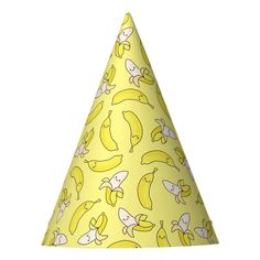 a yellow party hat with bananas on it