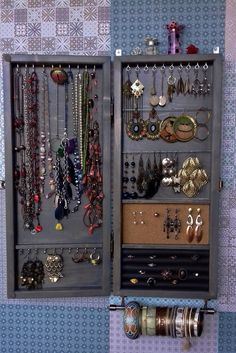 a jewelry organizer is shown with many necklaces and bracelets hanging on the wall