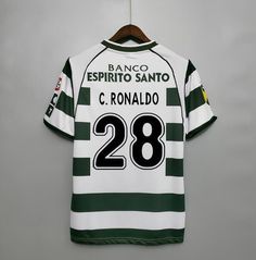 a soccer jersey hanging on a hanger with the name and number 28 printed on it