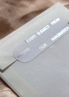 a close up of an envelope with some stickers on the front and back of it