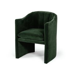 a green velvet chair with curved legs