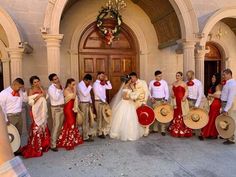 a group of people standing in front of a building