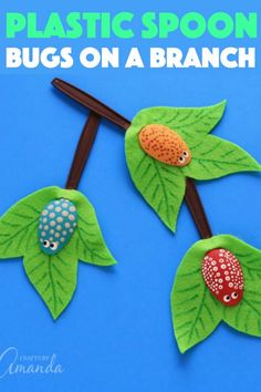 three plastic spoons with bugs on a branch in the shape of leaves and ladybugs