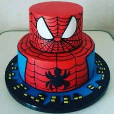 a spiderman themed cake on a table