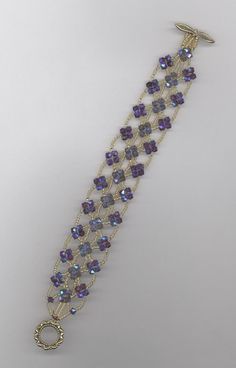 a bracelet with purple and blue beads on it