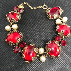 Big, bold & one of my favs Looks great on & makes a great statement **Vintage Red Jeweled Bracelet**. Bracelet measures approx. 7 " X 1" In excellent vintage condition. Don't miss out on this beauty! You will not be disappointed. Signed Hollycraft Thanks for stopping by. Hope you can come back often as I am constantly listing new beauties! Stop by my shop to take a peek at a lot  more vintage jewelry & collectibles.... www.etsy.com/shop/martinimermaid d504 1940s Jewelry, Vintage Bracelet, Vintage Bracelets, Designer Jewelry, Vintage Signs, Link Bracelets, Chain Link, Vintage Jewelry, Jewelry Bracelets