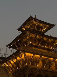 the clock tower is lit up at night