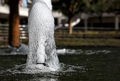 a fire hydrant spewing water into the air