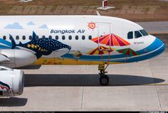 an airplane is painted with colorful designs on it's tail end and the nose