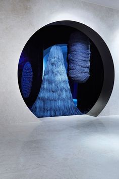 an art installation with blue and black objects in it