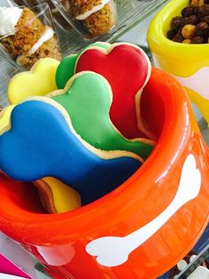 colorful bowls filled with different types of treats