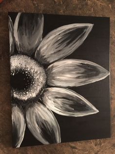 a black and white painting of a sunflower