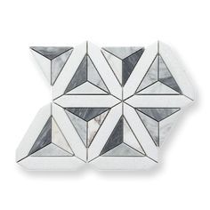 three white and black marble tiles with geometric shapes