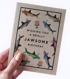 someone is holding up a card that says, wishing you a really jawome birthday