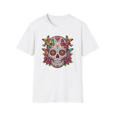 This sugar skull has floral patterns and butterflies celebrates the beauty and tradition of Dia de los Muertos. Perfect for those passionate about Mexican folklore, it captures the essence of honoring loved ones and embracing life's vivid colors. For butterfly enthusiasts and those drawn to sugar skulls, this design combines transformation and remembrance. A stunning visual statement, reflecting a deep appreciation for heritage and nature's beauty. The unisex soft-style t-shirt puts a new spin on casual comfort. Made from very soft materials, this tee is 100% cotton for solid colors. Heather colors and sports grey include polyester. The shoulders have twill tape for improved durability. There are no side seams. The collar is made with ribbed knitting to prevent curling damage.  .: Made wit Sugar Skull Tee Shirts, Honoring Loved Ones, Mexican Folklore, Sugar Skulls, Miami Fl, Soft Style, Floral Patterns, Twill Tape, Sugar Skull