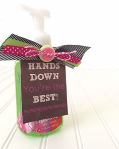 a hand sanitizer with a sign on it that says hands down you're the best