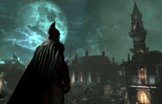 the dark knight is standing in front of a castle with a full moon behind him