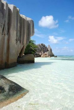 the water is crystal clear and there are rocks in the ocean next to each other