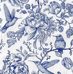 a blue and white floral pattern with hummingbirds on it's side, as well as flowers