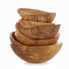 a stack of wooden bowls sitting on top of each other