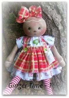 a small teddy bear wearing a dress and striped tights sitting next to a tree