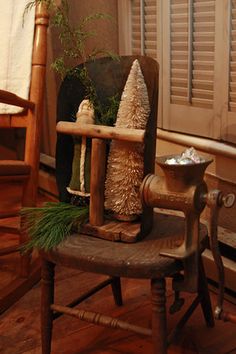 an old chair and table in a room