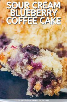 blueberry sour cream coffee cake on a plate with the words sour cream blueberry coffee cake