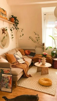 a living room filled with furniture and lots of plants