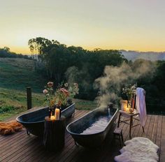 an outdoor hot tub on a deck with candles