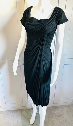 "Amazing 1950s Black Drape Jersey Dress by Iconic designer Ceil Chapman. This dress is in perfect condition no flaws and hangs beautifully. It is boned and lined to flatter the body and give the wearer that hourglass figure.. hence why Ceil Chapman was a favourite of Marilyn Monroe.  Size XS Bust: 33\" Waist: 24-26\" max Hips: 34\" max  Shown on a mannequin measuring  Bust:32\" Waist: 24\" Hips 33\" Fits mannequin perfectly" Vintage Ruched Cocktail Dress, Black Drapes, Draped Dress, Jersey Dress, Vintage 1950s, Dress Clothes For Women, Icon Design, Favorite Outfit, Dress Outfits