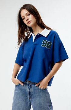 PacSun's Oversized Rugby T-Shirt brings a touch of preppy charm to the scene. Featuring a classic collared neckline, button closures, short sleeves, left chest patches, and the perfect relaxed fit, it's the epitome of laid-back style. Score some easygoing vibes with this must-have tee.Collared necklineShort sleevesButton closuresRelaxed oversized fitLeft chest patch detailMachine washableModel is wearing size smallModel measurements: 5’7” height, 32.5” bust, 25.5” waist, 36” hip PacSun Womens Oversized Rugby T-Shirt - Blue size Medium Pacsun T Shirts, Rugby Shirt Aesthetic, Short Sleeve Button Up Shirt Outfit, Oversized Polo Shirt Outfit Women's, Oversized Polo Outfit, Blue Tshirt Outfit, Nba Style, Oversize Tshirt Outfits, Polo Shirt Outfits