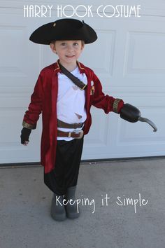 a little boy dressed up as a pirate with a hammer in his hand and the caption harry hook costume keeping it simple