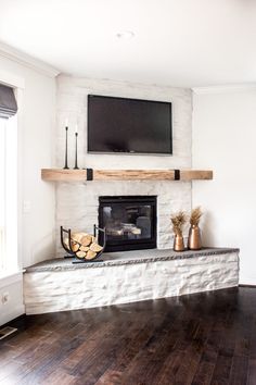 a fireplace with a flat screen tv above it