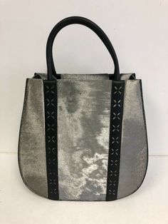 SIWWAA Chanzo Collection Women's Tote  Calf Skin Leather - SILVER High End Quality Bag with Strap Brand New Limited Edition Made in Italy Other info: Ships with Bag and Strap. Materials: • Exterior: responsibly sourced black flat calfskin and black calf hair leather • Interior lining in black microfiber suede • Pocket piping in white flat calfskin • Palladium-plated hardware Details: • 35 (W) x 35 (H) X 16 (D) CM / 13.7 (W) x 13.7 (H) x 6.3 (D) IN – at the widest parts • Handle drop: 14 CM / 5.5 Calf Hair Handbags, Info Ships, Mini Tablet, White Flat, White Flats, Leather Silver, Calf Hair, Womens Tote, Black Flats