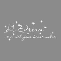 a dream is a wish your heart makes wall decal in white on a gray background