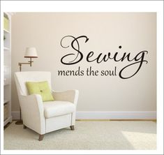 a white chair sitting in front of a wall with the words sewing means the soul