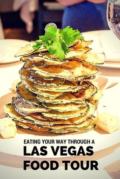 a stack of food sitting on top of a white plate