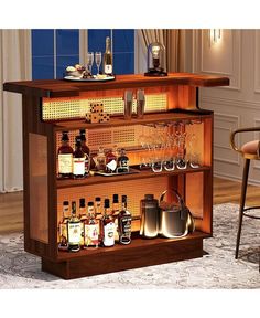 a bar with liquor bottles and glasses on it's shelves in a living room