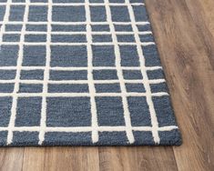 a blue rug with white squares on it