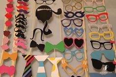 many different types of glasses and ties on display