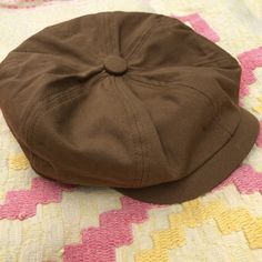 "Love this cap! It's a very authentic looking retro 90's does 40's newsboy cap. Curved brim, elastic back. Lined. Fits a range of head sizes because of the elastic back. Leather tab with Basic Blues brass rivet. Tagged 60. Great color, style and fit. Good vintage condition, no major issues, swear stains or smells. Measured flat: 8\" up to 9.5\" Please measure against yourself for best fit." Vintage Brown Beret Flat Cap, Retro Brown Flat Cap Baseball Cap, Retro Brown Beret For Fall, Brown Cotton Brimmed Baseball Cap, Retro Brown Cotton Hat, Brown Retro Beret For Fall, Brown Cotton Retro Hat, Brown Retro Cotton Hat, Retro Adjustable Beret For Fall