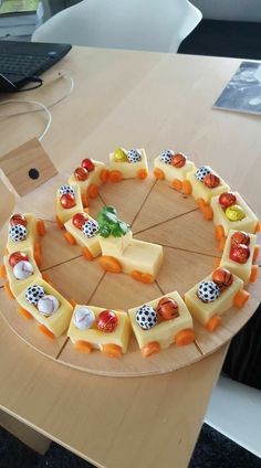 a wooden table topped with slices of cheese