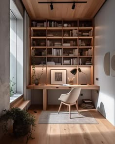 a home office with wooden shelves and bookshelves