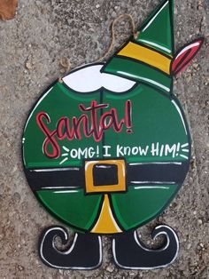 a sign on the ground that says santa some i know him is coming to town