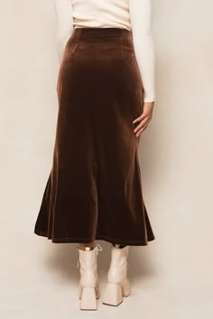 Embrace a playful and maternity-friendly look with our Logan Skirt in Brown. Made with soft velvet fabric, this midi-length skirt features an elastic waistband, hidden side zipper, and fabric with stretch for a comfy fit. Finish off the perfect fall outfit with one of our beautiful blouses. Cheap Pleated Fall Bottoms, Long Fall Skirts, Suede Midi Skirt Outfit, Casual Midi Skirt Outfit, Brown Maxi Skirt Outfit, Fall Maxi Skirt Outfits, Midi Skirt Outfits, Velvet Skirts, Brown Midi Skirt