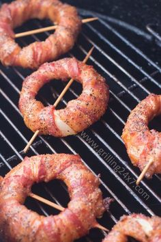 bacon wrapped pretzels are cooking on the grill