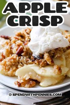 an apple crisp on a plate with whipped cream and pecans in the background text overlay