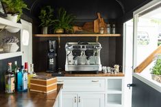 a coffee machine sitting on top of a wooden counter