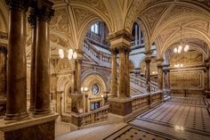 the inside of a building with marble floors and pillars